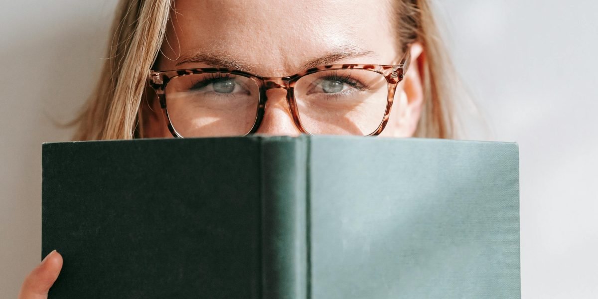 A person engrossed in a book, reflecting the high tension and urgency of A Song of Ice and Fire.