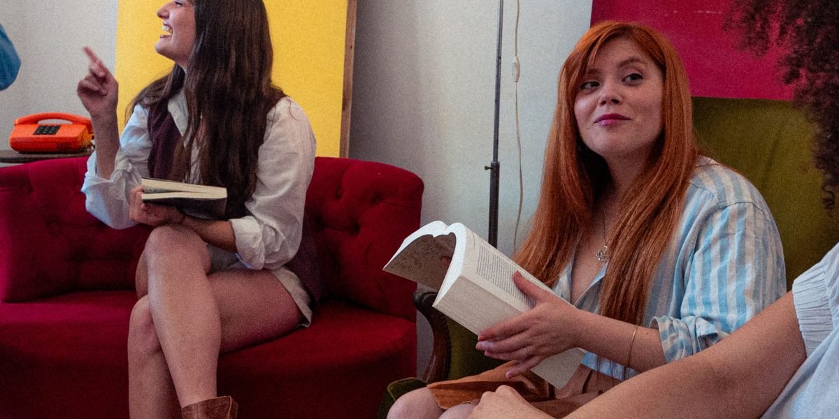A diverse book club actively discussing a humorous novel, sharing their interpretations and laughs.