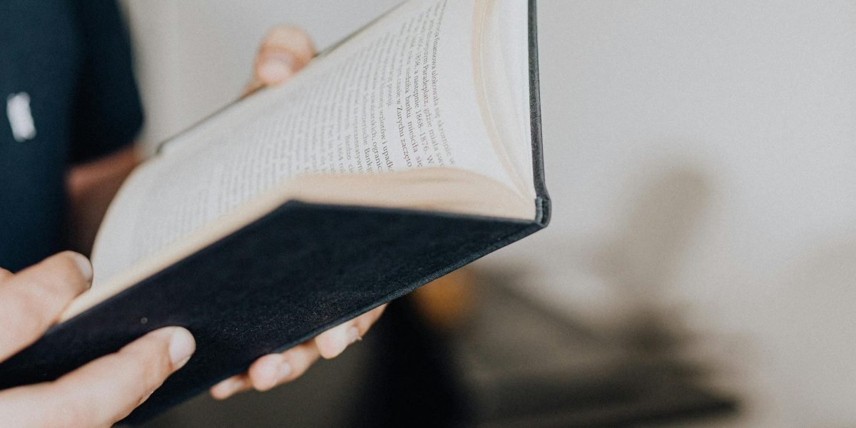 A reader deeply engrossed in a book, reflecting the lasting impact of Kristin Hannah's stories.