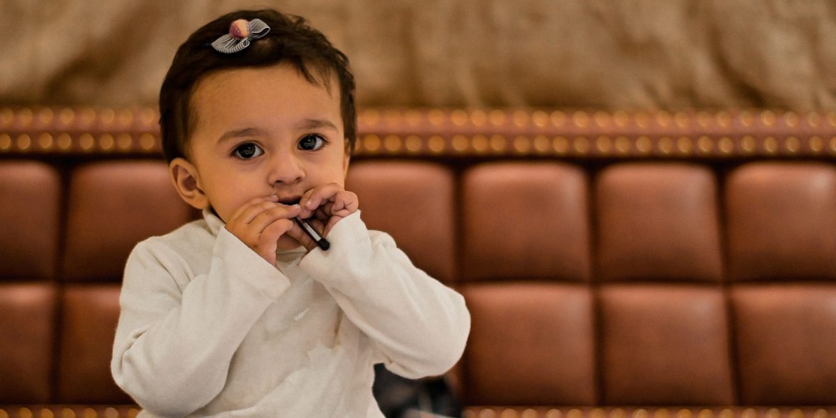 A child browsing shelves in a library or bookstore, curious about the many book options available.