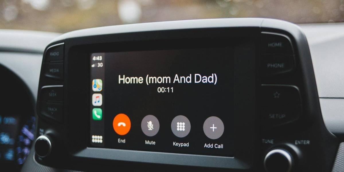 A family enjoying an audiobook together during a car ride, sharing a story and making the commute enjoyable.