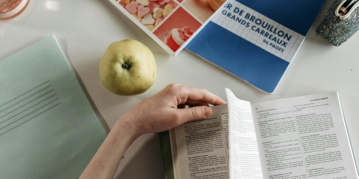 A collector carefully inspects an old, valuable book, appreciating its history and condition.