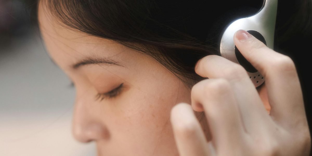 A person engrossed in an audiobook, enjoying an immersive story experience.