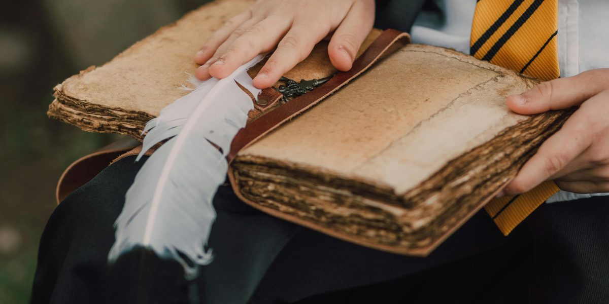 A reader deeply engrossed in a fantasy novel, captivated by the intricate world-building.